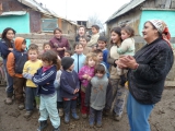 Children in Ciocaia gathering and singing to us